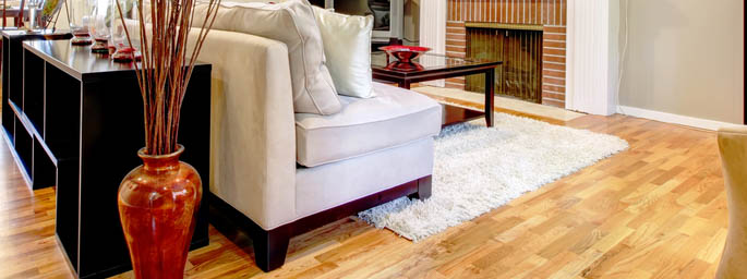 protect your refinished hardwood floor with an area rug