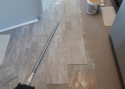 grey luxury vinyl tile during installation