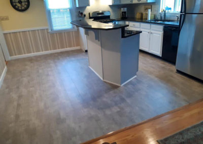 grey luxury vinyl tile kitchen installed